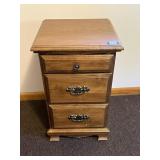 A small bedside table or a table. Measures