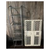 A small metal shelf and an Evenflo baby gate. The