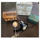 A box fan, a magazine rack, a spotlight, and