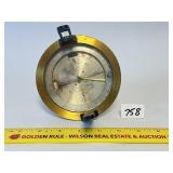 An antique Made in France brass compass. The