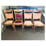 Four oak dining room chairs. Three match one is a