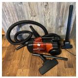 A Eureka whirlwind vacuum - Located in BR1 Closet