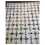 A quilt top. Measures approximately 67 x 80.