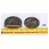 A pair of solid brass belt buckles
