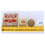 A vintage cigar tin. A vintage pill box. And a
