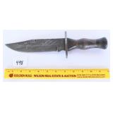 A large Damascus blade knife