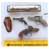 Some small vintage cap guns and cutting one that