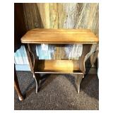 A small side table. It does have a magazine rack