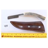 A Damascus blade shaving knife with sheath