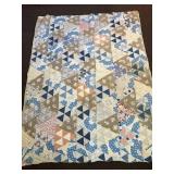 a vintage hand-stitched quilt. It does have some