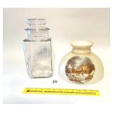 A vintage glass Kiss Me Gum jar. It