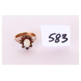 A ladies ring with stones it is marked 10K