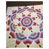 A large star pattern quilt top. Measures
