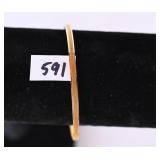 A bracelet marked 14K