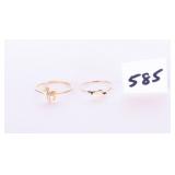 A pair of rings one has a horse with a stone
