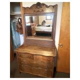 Antique dresser with mirror. It is missing one