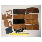 Some tooled leather wallets. Some are complete.