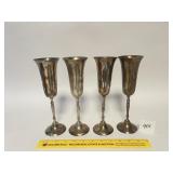 A set of four matching silver plated goblets -