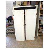 Wooden Cabinet, metal on back, has doors to