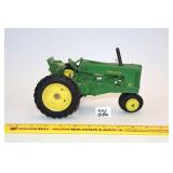 Vintage Ertl Diecast John Deere toy tractor, has