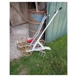 Garden Seeder & Cultivator     Located in barn