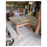 Wooden Table w/ laminate top, closer to bar