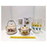 Group of kitchenware including glass pitcher