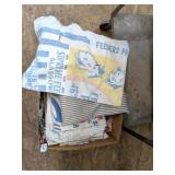 Box of vintage fabrics including feed sacks from