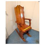 Wooden Rocking Chair; has a few small holes on