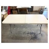 Plastic folding table; 29 1/2 in T x 72 in L x 29