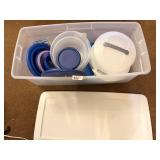 Tote of plasticware including a cake taker; tote