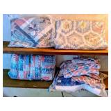 Group of quilts and crocheted throws, including