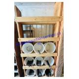 Rack of Buckets of Black Pipe Nipples