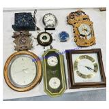 Lot of small wall clocks
