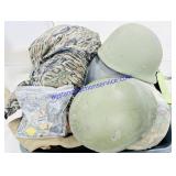 Tub of Military Helmets and Clothing