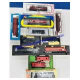 (12) In Box HO Scale Model Train Cars & Engines