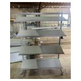 One Rolling Display Rack With Adjustable Shelves