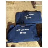 One AED Little Anne  one Regular Manikin