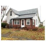 12.17.25 3 BEDROOM HOME WITH ENCLOSED PORCH & DETACHED GARAGE ON A CORNER LOT!