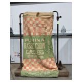 ANTIQUE FEED SACK HOLDER WITH PURINA RABBIT CHOW
