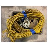 TOTE FULL OF EXTENSION CORDS