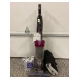DYSON VACUUM WITH ACCESSORY KIT AND CARPET POWDER-