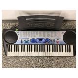 CASIO LK42 ELECTRIC KEYBOARD WITH STAND AND MUSIC