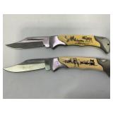 2 FOLDING POCKET KNIVES - WOLF AND DEER