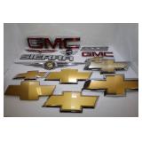 LARGE LOT OF ASSORTED AUTOMOBILE EMBLEMS