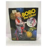 BOBO THE BIKER BATTERY OPERATED TOY - NEW IN