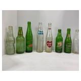 LARGE LOT OF ASSORTED POP BOTTLES -  7 UP, 76,