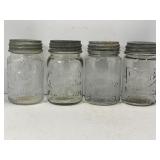 LOT OF 4 VINTAGE EMBOSSED GLASS JARS WITH ZINC