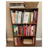 SHELVING UNIT WITH LARGE SELECTION OF COOKBOOKS,