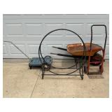 METAL FIREWOOD RACK, WHEELBARROW AND ROLL AROUND